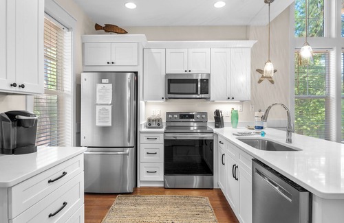 Laurel Grove House | Charming Beach Cottage w/2 GOLF CARTS! Pool, Hot Tub, Beach Tram, Near Wharf