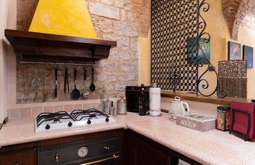 Spello Apartment | Charming brick and stone loft in a 17th-century chapel in the historic center
