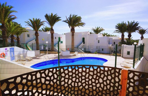Bahia Calma House | Charming bungalow in the palms at the pool in delightful Costa Calma with WiFi
