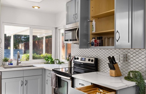 Claremont House | Charming Claremont home near parks and shopping, with open layout and large lot.