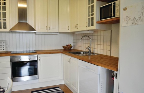 Kristinehamn House | Charming cottage with fireplace and lake view.