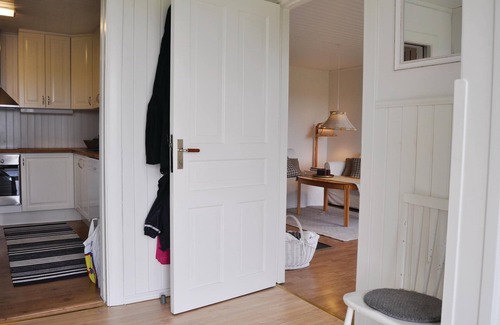 Kristinehamn House | Charming cottage with fireplace and lake view.