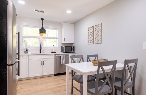 Blacksburg House | Charming entry and spacious back deck surrounded by nature, perfect for a peaceful getaway.
