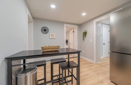 Blacksburg House | Charming entry and spacious back deck surrounded by nature, perfect for a peaceful getaway.