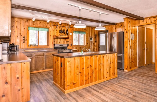 Manitowish Waters House | Charming lake view dog-friendly home with fireplace, deck, kitchen, and dock