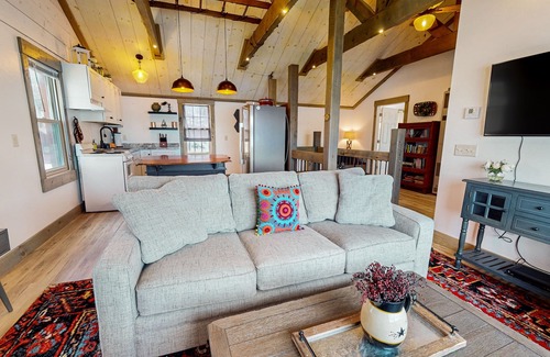 Arbor Vitae Cabin | Charming lakefront cabin with fireplace, cozy interior, streaming, & partial AC