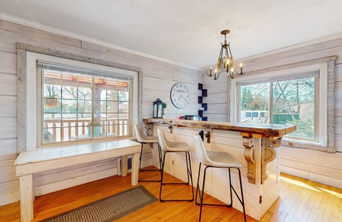 Arbor Vitae Cabin | Charming lakefront cabin with fireplace, cozy interior, streaming, & partial AC