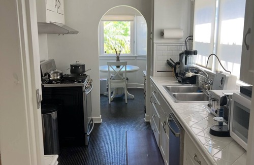 Mid City House | Charming Spanish Bungalow w/lush enclosed yard and back deck