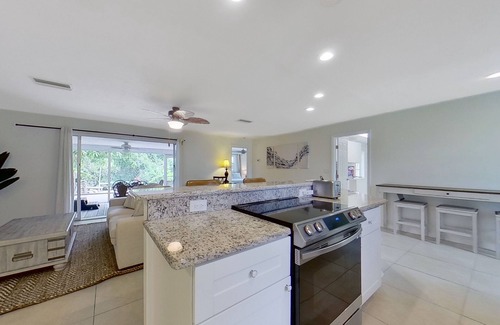 Fort Myers House | Charming waterfront home with firepit, central AC, W/D, & dog-friendly