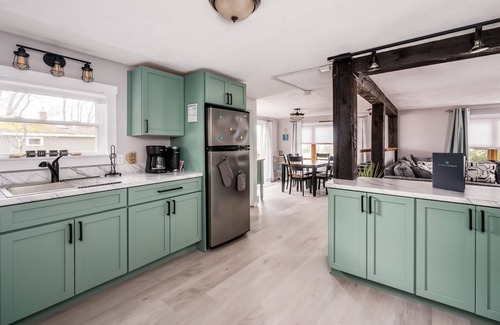 Lochmere House | Charming waterfront on Silver Lake home with a sandy beach and wraparound deck