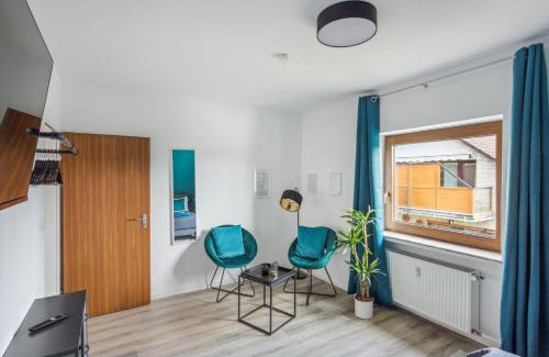 Hamelin Apartment | Charysma - Weserufer, stylish, Schlafzimmer mit Smart-TV, 2 Parkplätze