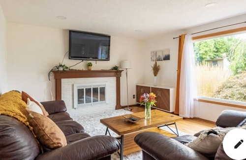 Russell House | Cheerful 4 bedroom home with fireplace!