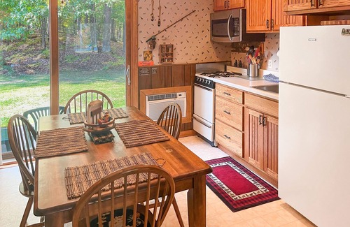 Eagle River Condo | Cheerful Condo w/Private Patio, Shared Tennis, Basketball, and Game Room