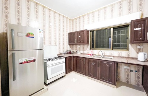 Madaba Villa | Cheerful two bedrooms villa with warm pool, playground,& specious sitting room.
