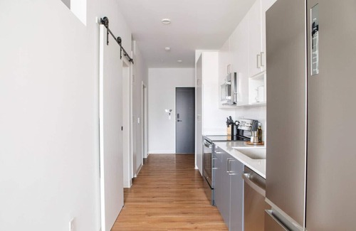 Yankee Hill Apartment | Chic East Side 1BR Apt with Balcony, Pool, and Gym