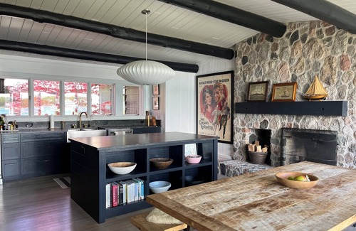 Northport Cottage | Chic log home, styled with flair, updated with modern amenities.