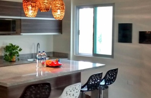 La Veleta Condo | Chic Penthouse on 2ET, 3BR, 2BA, Wi-Fi, a rooftop terrace overlooking the garden and pool