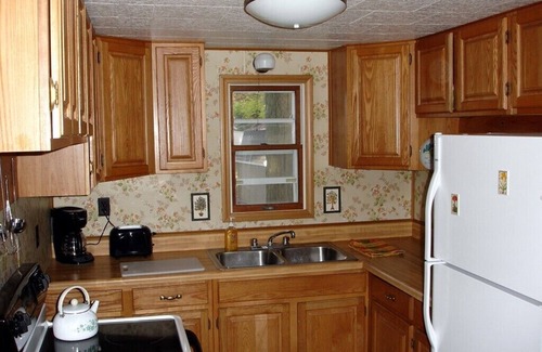 Tawas City House | Classic and Affordable Lake Home, WWII Display, Canoe, Deck, Quiet Neighborhood