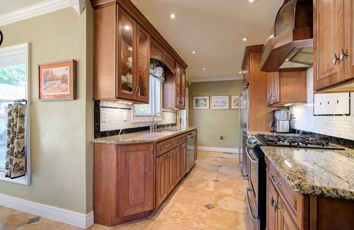 Central Oklahoma City House | Classic Luxury Tutor and Garden Studio with Private Backyard