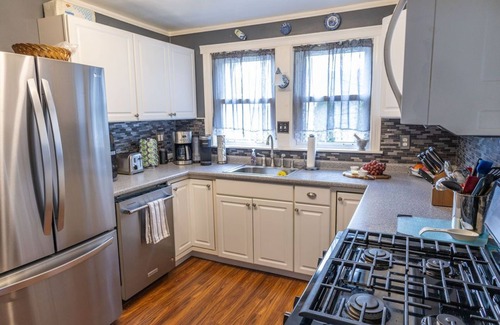 Portland House | Classic Maine home in quiet tree-lined street neighborhood with fenced in yard