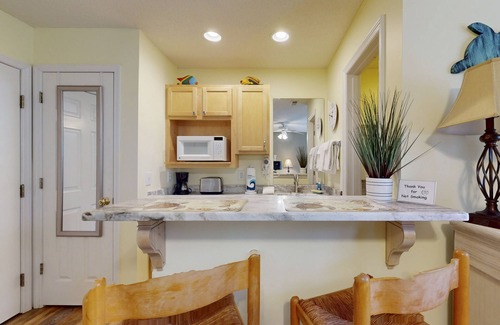 St. James Condo | Coastal Condo with golf course view and shared pool access