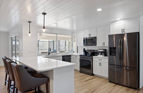 Shell Harbor House | Coastal Cottage on Canal, East End with Pool