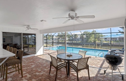 Shell Harbor House | Coastal Cottage on Canal, East End with Pool