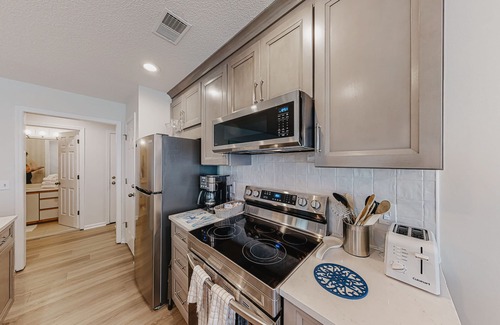 Sea Trail Condo | Coastal resort condo with on-site pools, hot tub, game room, & golf