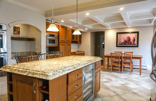 Benton Harbor House | Colonial style 5BR/5BA home tucked in a private, wooded setting w/pool & hot tub