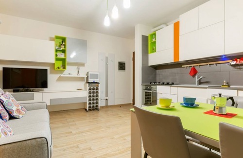 Le Cure Apartment | Colorful Boccaccio apt with Patio and Motorcycle Place