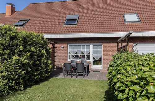 Harlesiel House | Comfortable and idyllic: The mid-terrace house with its 65 square meters located behind de