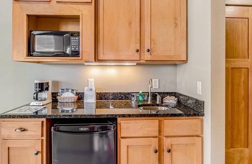 Three Lakes Condo | Comfortable lakefront studio with balcony, kitchenette, pool, gym, & hot tubs