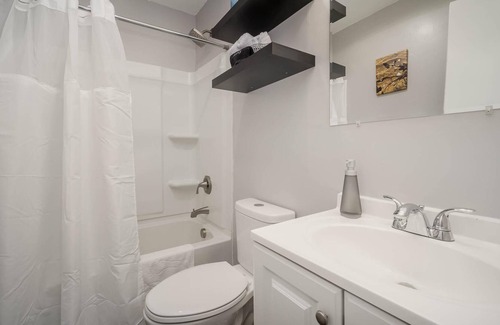 Rock Hill House | Comfortable ranch home with an art gallery vibe, updated kitchen and 55-inch smart TV.