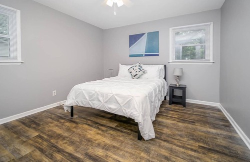Rock Hill House | Comfortable ranch home with an art gallery vibe, updated kitchen and 55-inch smart TV.