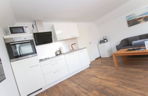 Norddeich Apartment | Comfortable vacation apartment Kranich 2 with balcony in Norddeich, close to the sea