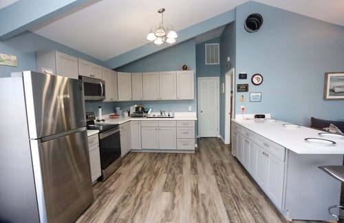 Jamaica Beach House | Comfy Canal Home 2 Min Dr to Beach + Outdoor Space/Fishing!