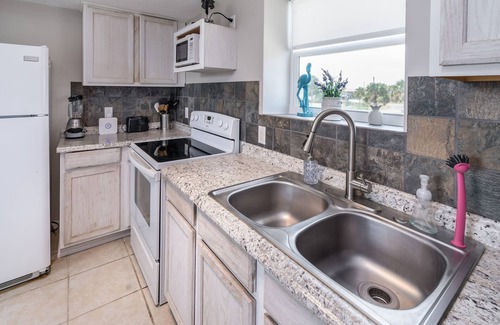 St. George Island House | Comfy King beds, close to beach, pool + pet friendly