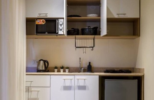 Cairo Apartment | Comfy Studio with Balcony | Queen Bed , Sofa and Kitchenette and shared community garden