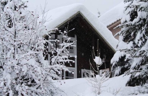 Allos Ski Chalet | Cosy detached Alpine chalet with log fire, balcony and mountain views - sleeps 8