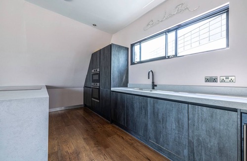 Kentish Town Apartment | Cosy Penthouse in North London. Private king size bedroom with luxury bathroom.