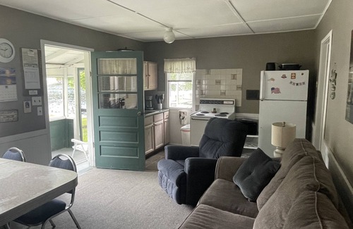 Ludington Cottage | Cottage 2 is a 2 bedroom 25’ from its boat dock & Hamlin Lake