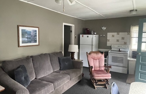 Ludington Cottage | Cottage 4 is a charming 2 bedroom 25’ from your boat dock & Hamlin lake
