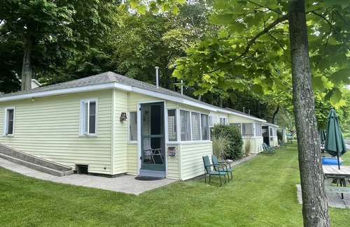 Ludington Cottage | Cottage 4 is a charming 2 bedroom 25’ from your boat dock & Hamlin lake