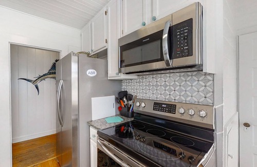 Atlantic Beach Cottage | Cottage in the heart of Atlantic Beach with ocean views, two decks, WiFi, & W/D