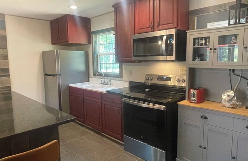 Mill Spring Cottage | Cottage on the water. Kayaks Fishing Fire Pit. 5 mins from TIEC. 15 to Lake Lure