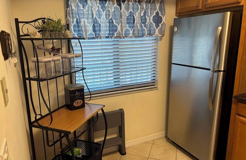 Iona Condo | Couples' lake-view condo perfectly located near beaches, dining & stores!