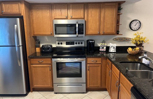 Iona Condo | Couples' lake-view condo perfectly located near beaches, dining & stores!