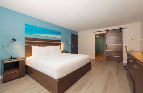 Harbor Hotel | Cove Hotel, King Suite | Relax by the Pool, Sip at the Bar, Stroll Downtown