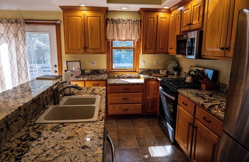 Gilford House | Cozy and fully renovated 4-bedroom rental property, available for you to enjoy.n