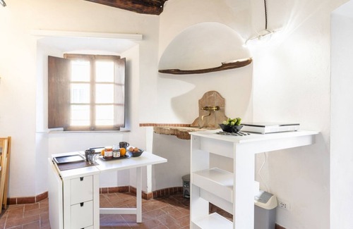Castagneto Carducci Apartment | Cozy apartment of about 35sqm located on the ground floor of a renovated period building, without elevator (steps to access it). The accommodation is located in the historic center of Castagneto Carducci, a medieval village named after the well-known Ita